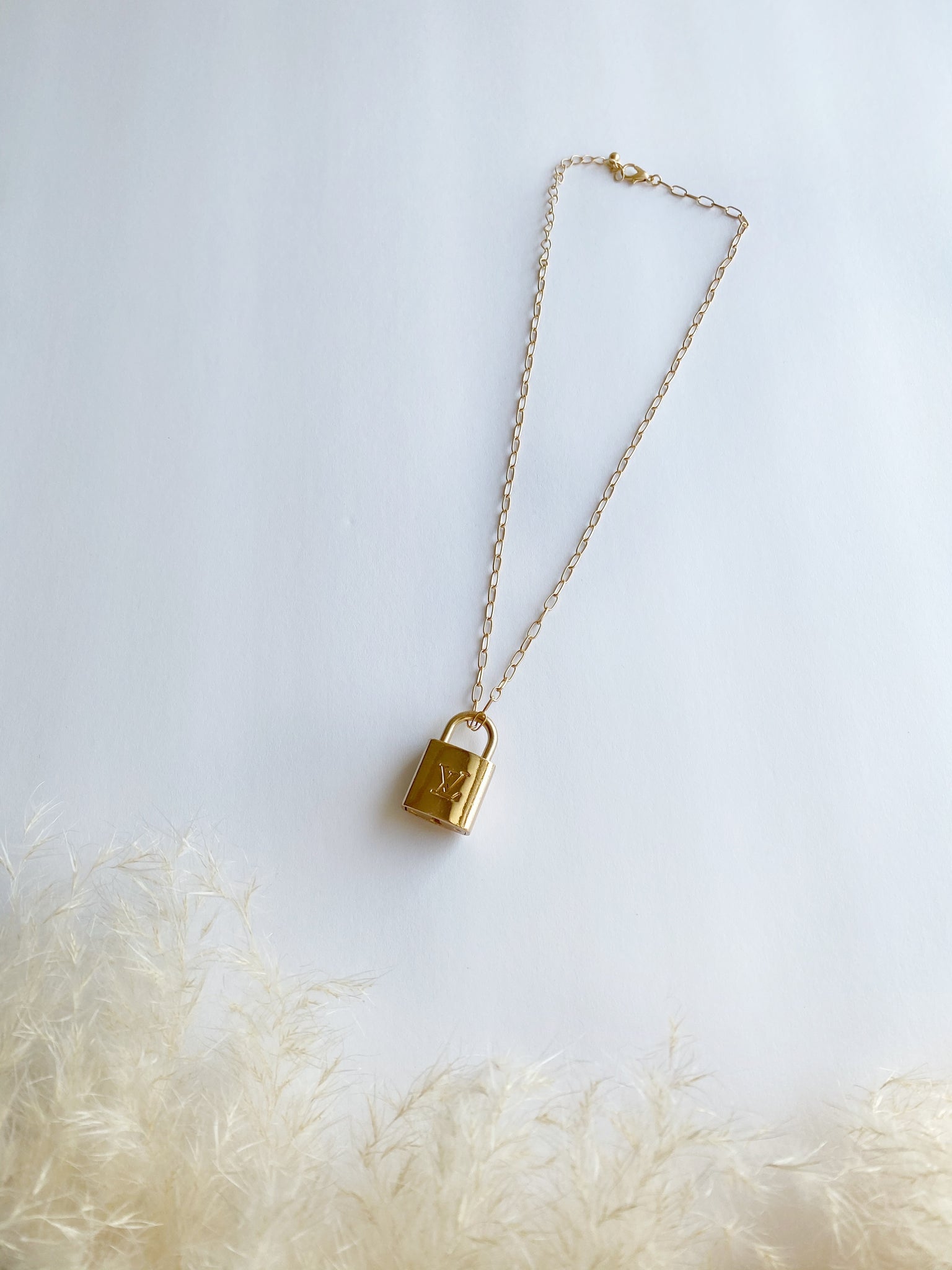 LV lock necklace